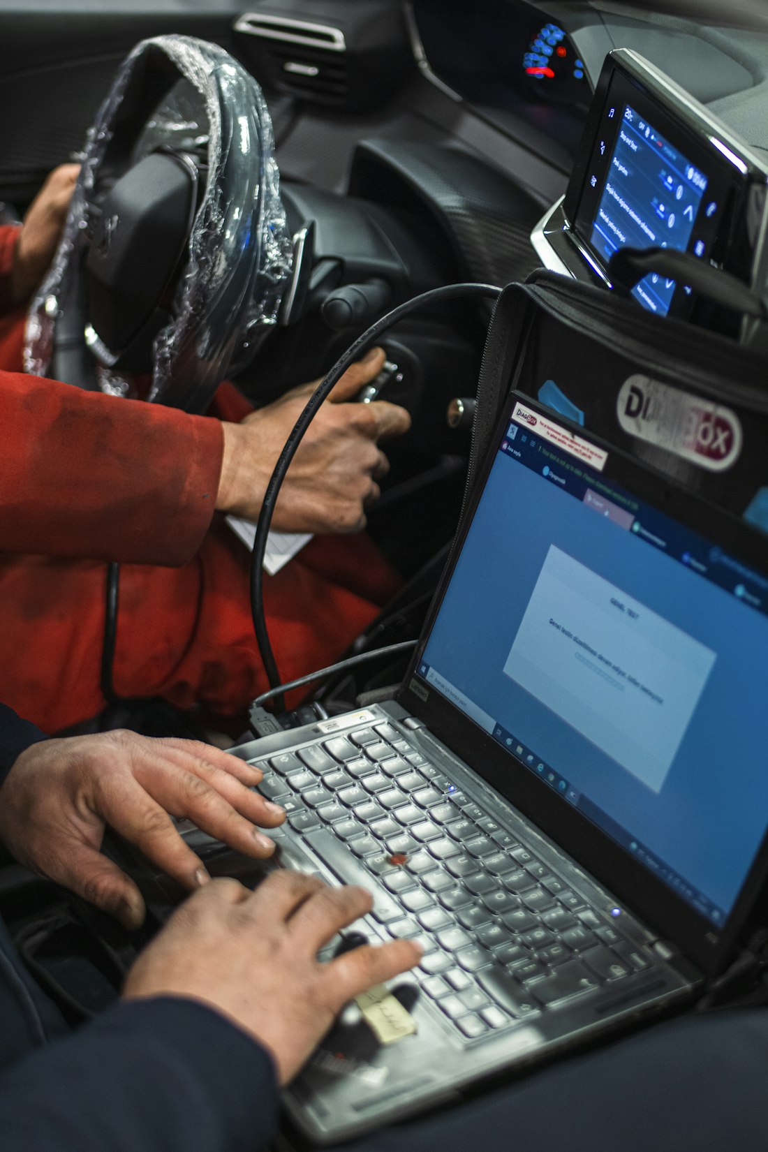 A diagnostic tool plugged in to reflash the ECU — Stage 1, software only
